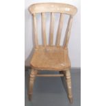 A Victorian lath back kitchen chair on turned legs.