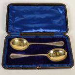A pair of bright cut, parcel gilt, silver serving spoons, Old English pattern, 5oz.