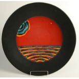 A Poole Pottery charger,