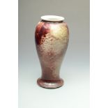 A Ruskin baluster shape flared foot vase with liver red and grey mottled glaze,