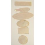 A quantity of Chinese mother of pearl gaming counters in various shapes including 39 fish,