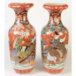 A pair of Japanese Fukugawa style baluster vases decorated in coloured enamels with two equestrian