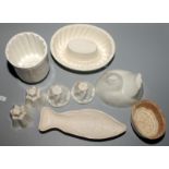 Nine jelly moulds including 'Greens Newstyle Jellies' in the form of a chicken,