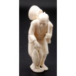 A Japanese ivory okimono,