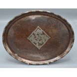Hugh Wallis, an Arts and Crafts oval, planished copper tray,