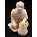 A Japanese ivory okimono,