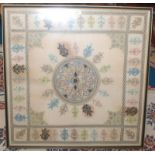 A Russian square embroidered panel, with a central circular medallion, framed and glazed, 84cm.