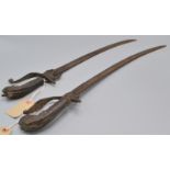 Two small, late 18th century Anglo-Indian cutlasses, each with a lion's head carved wood grip,
