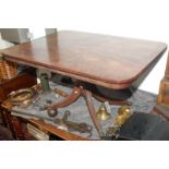 A George III mahogany snap top rectangular crossbanded buttress table on turned pedestal with