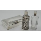 A silver cigarette box and a glass toilet bottle in Victorian silver sleeve, Birmingham 1901.