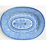 A Chinese blue and white porcelain, oval serving dish decorated with an intricate,