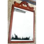 A mahogany frame mirror.