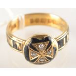 An 18ct. gold memoriam ring with black enamel and diamonds, makers mark T.E.