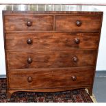 A late Georgian large mahogany chest with ebony lines,