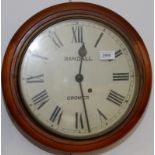 A dial timepiece in a mahogany case the white face signed Randall, Cromer, diameter 38cm.