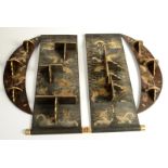 Two pairs of Chinese black lacquered and gilt decorated wall shelves decorated with dragons and