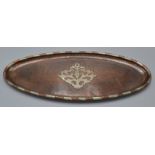 Hugh Wallis, an Arts and Crafts narrow, oval, planished copper tray,