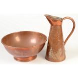 An Arts and Crafts hammered copper jug, height 30cm and a plain footed copper bowl, diameter 30.5cm.