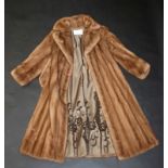 A 'Canada Majestic Mink' full length lady's coat with tie belt, Burkholders Fur Ottawa Canada label,