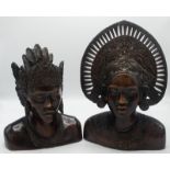 A pair of Klungkung, Bali hardwood busts, she wears a pierced headdress, he has an ornate coiffure,