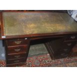 An oak veneered twin pedestal desk.