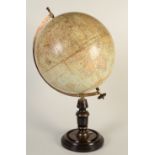 A 13" terrestrial table globe circa 1905 retailed by John Heywood, Manchester and London,