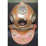 A Drager/Haganuk copper and brass diver's helmet with a pepper pot air outlet valve and two air