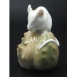 A Royal Copenhagen mouse on a green chestnut, No.511, height 6.5cm.