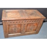A 17th century joined oak small chest, the lid with two plain panels,