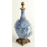A European faience, blue and white pottery pilgrim flask, converted to a lamp base,