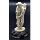 A Japanese ivory okimono representing the fairy story 'Shitakiri Suzume',