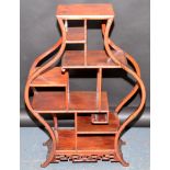 A Chinese hardwood display stand in the form of a Hu shape vase,