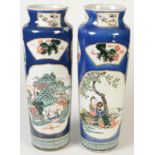 A pair of Chinese Canton porcelain vases decorated with reserve panels of figures, landscapes,
