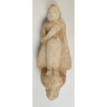 A 19th century Burmese alabaster figure of Buddha standing on a ledge, traces of gilding,