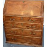 A George III mahogany slope front bureau.