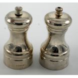 A pair of plain silver salt and pepper mills, London 2005, height 10cm.