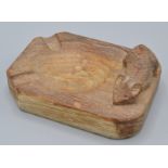 A Robert Mouseman Thompson oak ashtray carved with a mouse, 10cm.