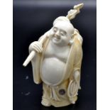 A Japanese ivory okimono of Hotei, the God of Contentment and Happiness,