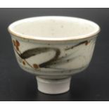 A miniature bowl by Derek Clarkson on short stem with speckled opaque creamy white glaze and