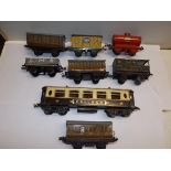 '0' gauge Hornby tin plate rolling stock including a bogey Pullman carriage.