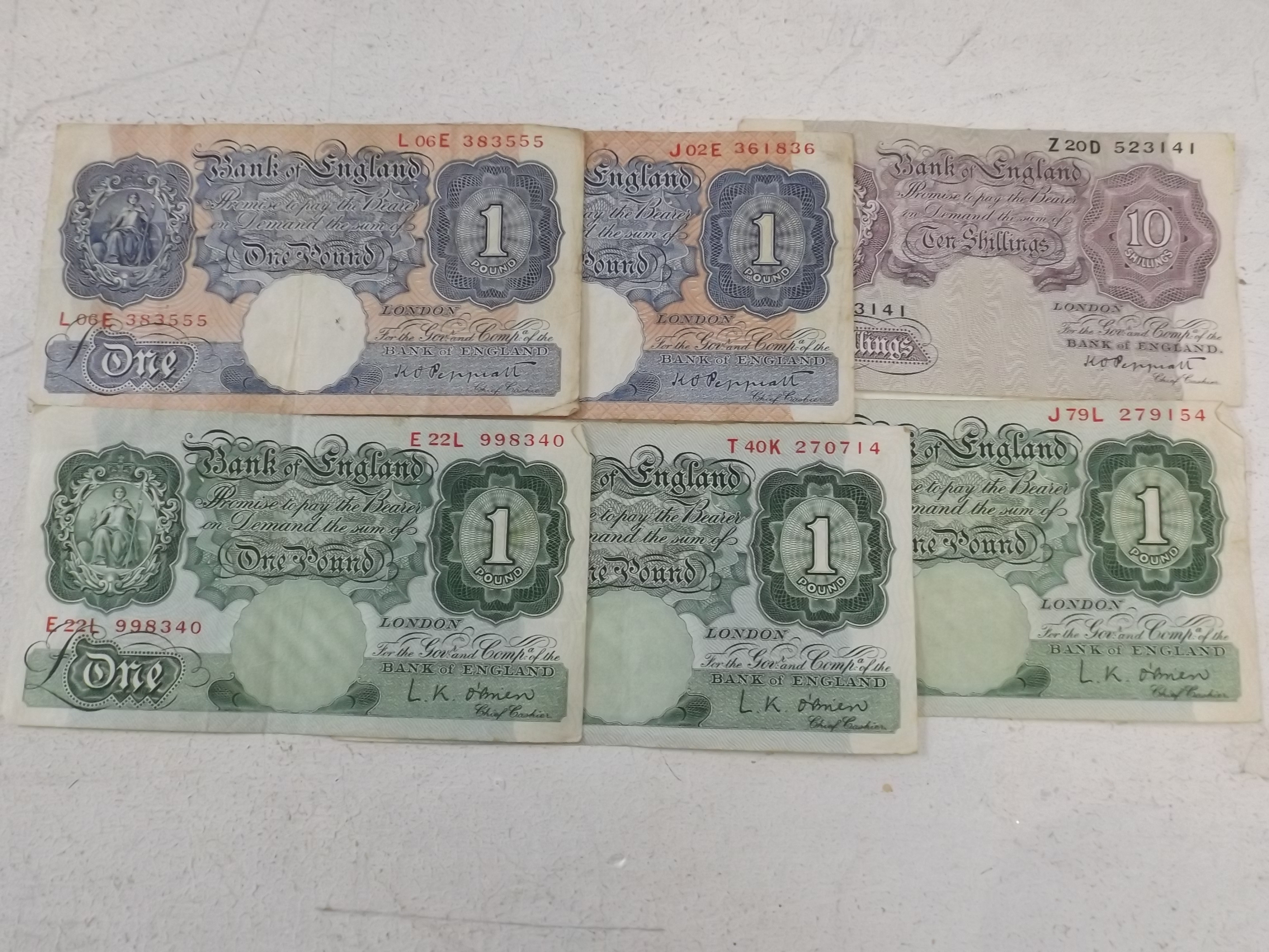 Banknotes:- 5x £1 including two war-time and a 10/- note.