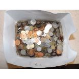 A large and heavy quantity of world coins.