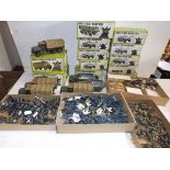 A collection of plastic military vehicles and figures,
