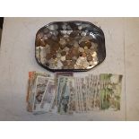 A quantity of banknotes mostly Portuguese and Spain, together with World coins.