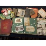 An Edwardian album containing several hundred postcards together with loose including several good