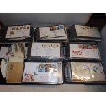 A collection of first day covers in seven albums together with a few postcards etc.