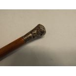 A Swagger Stick with a foliage embossed finial, vacant cartouch, lacks base cap.