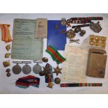 Three WWII medals, two 1939-45 Stars, badges buttons etc.