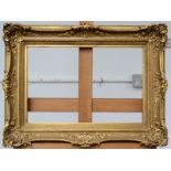 An ornate 19th century gilt picture frame Internal measurements 29 x 43.