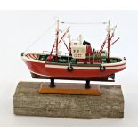 Artist: Boat donated Title: Boat on Baulk Size: 14 x 43 x 39(h) cm Medium: Baulk & Boat